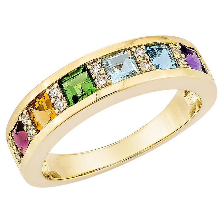 Presenting the rainbow Ring from Sunita Nahata's Rainbow Collection. This gorgeous ring is made up of vivid gemstones that reflect the rainbow's hues and symbolize hope, joy, and variety. This ring offers elegance and luxury while celebrating life's vibrant events. This 18-karat yellow gold ring has classic elegance and contemporary style, making it an ideal choice for any occasion. Rainbow Gemstone Ring in 18Karat Yellow Gold with White Diamond. Tsavorite: 0.19 carat, 3X3mm size, princess shape Rainbow Ring, Rainbow Rings, Rainbow Gemstones, Fancy Rings, Trendy Ring, Sky Blue Topaz, Modern Ring, Swiss Blue Topaz, Yellow Gold Ring