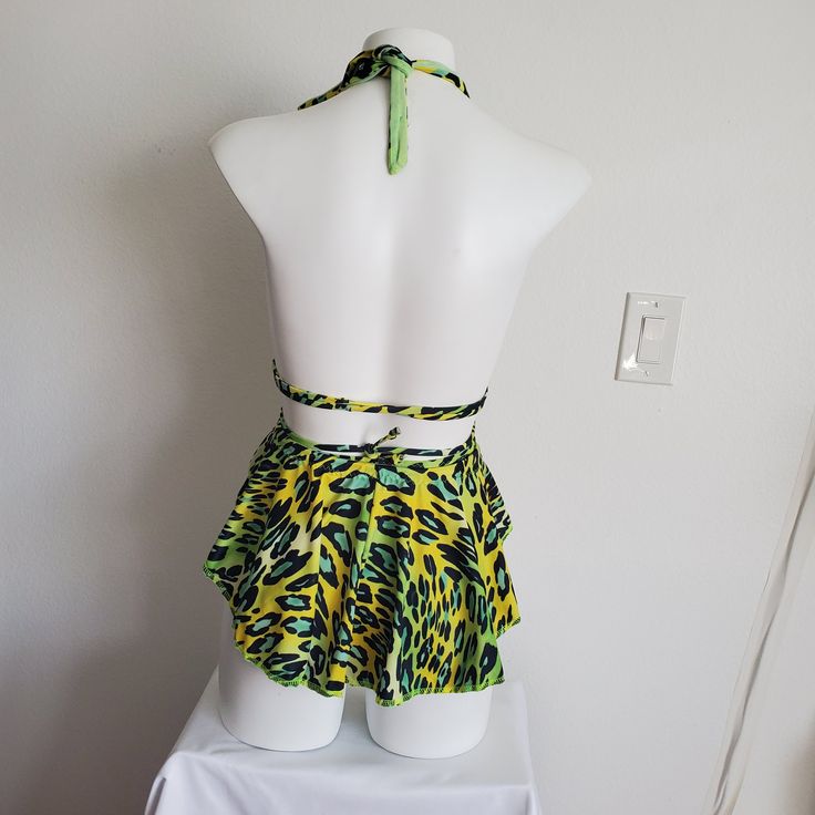 Size Small/XS This cute skirt is the perfect accessory to finish off any outfit! The skirt has 3/4 coverage, with a full back and curves up at the front. It is a full circle skirt, great for twirling and dancing. It is a single layer of fabric, with a mesh tunnel for the neon drawstring. Ready to ship in 1-2 business days from Los Angeles. Fitted Skort For Summer Parties, Stretch Mini Wrap Skirt For Summer, Flirty Fitted Skort With Lined Skirt, Fitted Flirty Summer Skort, Fitted Summer Mini Wrap Skirt, Fitted Ruffled Skort For Summer, Fitted Skirt For Vacation, Fitted Summer Wrap Skirt Pleated, Fitted Summer Wrap Skirt