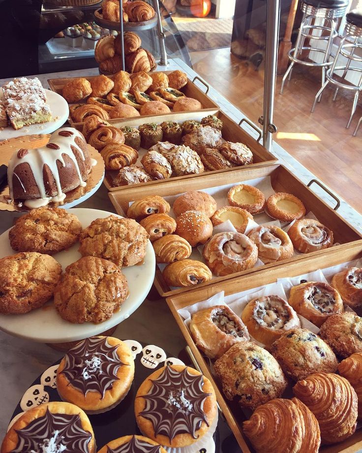 many different types of pastries are on display