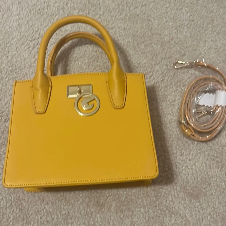 Mustard Yellow Bag, Brand New With Handled And Long Strap That Is Removable. Trendy Square Bag With Branded Hardware, Trendy Satchel With Branded Hardware For Shopping, Trendy Square Satchel With Branded Hardware, Gold Satchel With Detachable Handle For On-the-go, Trendy Everyday Box Bag With Branded Hardware, Trendy Box Bag With Branded Hardware, Yellow Crossbody Bag With Branded Hardware, Gold Satchel With Detachable Strap, Gold Trendy Satchel With Detachable Strap