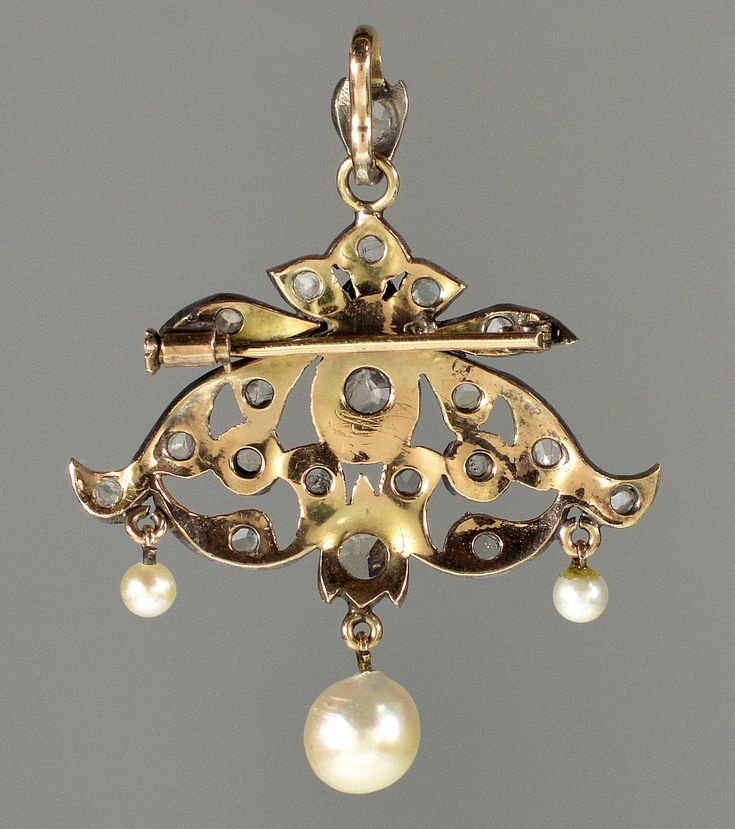 "This pendant is a great example of end of 19th century trend in jewelry. Elaborate design of the pendant incorporates total of 21 rose cut diamonds. The largest diamond, approx 5 mm across, set in crimped bezel mount in the center. The rose cut diamonds radiate a soft glitter under candle light of the ballrooms. Typically for the time the back of the pendant is gold and the front is sterling for better color fit to the diamonds especially with natural silver patina. The pendant would not be com Elegant Yellow Gold Baroque Brooches, Formal Art Nouveau Diamond Jewelry, Antique Yellow Gold Brooches With Intricate Design, Victorian Gold Diamond Brooches, Ornate Gold Brooch With Rose Cut Diamonds, Victorian Hallmarked Jewelry For Opera, Ornate Gold Brooches With Rose Cut Diamonds, Antique Yellow Gold Filigree Brooches, Victorian Diamond Brooch For Evening