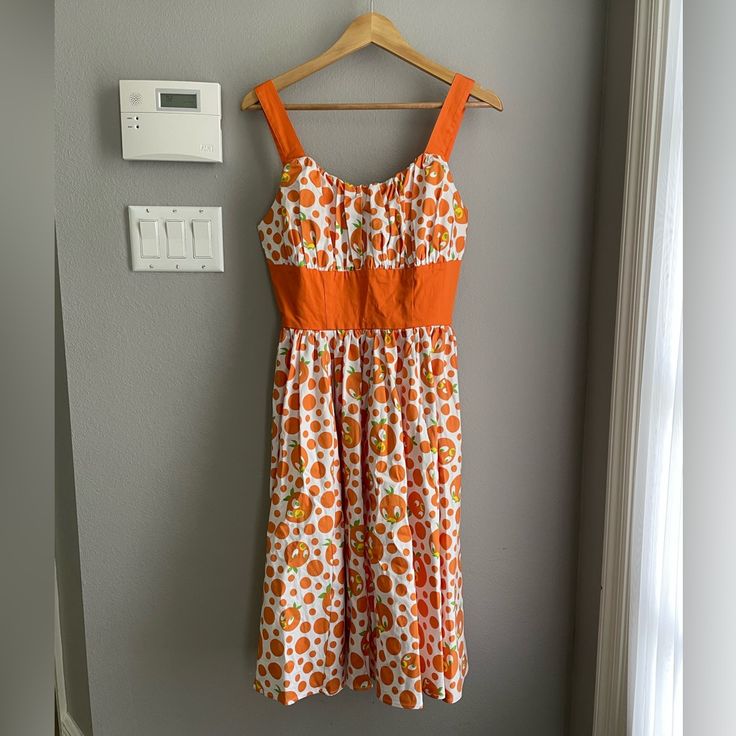 One Of The Cutest Dresses You'll Ever See Come Out Of The Dress Shop At Disney! This Is A Retired Design, Which Is Highly Sought After. Nice Quality And Gorgeous Craftsmanship. The Orange Bird Dress Is Size Medium, New With Tags, From A Non-Smoking Home. I Won't Be Sending Offers On This Listing Since Such A Large Portion Of It Goes To Poshmark And This Dress Is A Retired Design. So If You Love It, Snatch It Up! Fitted Orange Cotton Midi Dress, Vintage White Cotton Midi Dress, White Vintage Cotton Midi Dress, Pooh Dress, Minnie Mouse Sweater, Hawaiian Print Dress, Floral Tulle Dress, Spaghetti Strap Summer Dress, Denim Jumper Dress