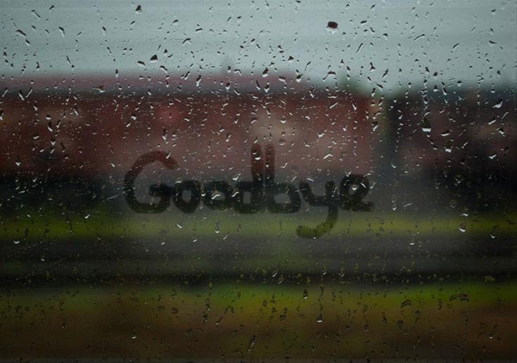 the word goodbye written in rain drops on a window