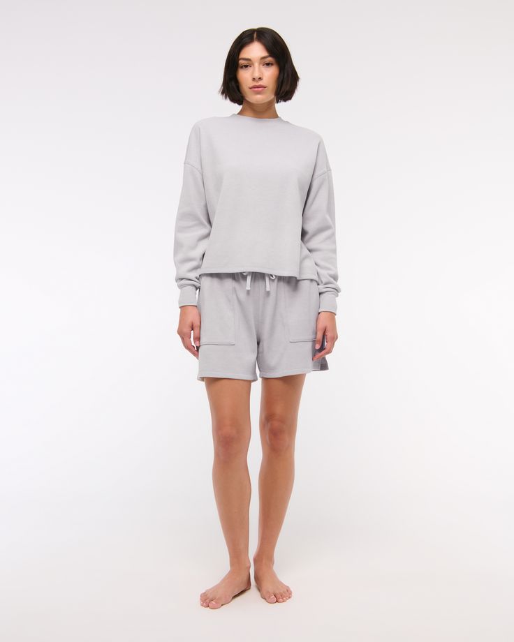 Comfy long-sleeve tee in our softAF fabric and oversized-fit silhouette, featuring an all-over grid micro-waffle texture, crew neckline and straight hem. Comfy Long Sleeve Spring Tops, Comfy Long Sleeve Tops For Spring, Sporty Relaxed Fit Tops For Daywear, Relaxed Long Sleeve Tops With Soft Texture, Oversized Long Sleeve Crew Neck Top For Loungewear, Gray Relaxed Fit Tops With Soft Texture, Gray Spring Sweatshirt For Loungewear, Gray Relaxed Fit Top With Soft Texture, Spring Athleisure Long Sleeve Loungewear Top