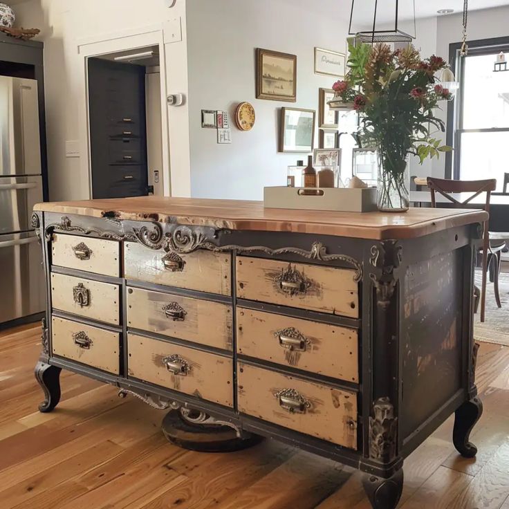 an old dresser is in the middle of a kitchen