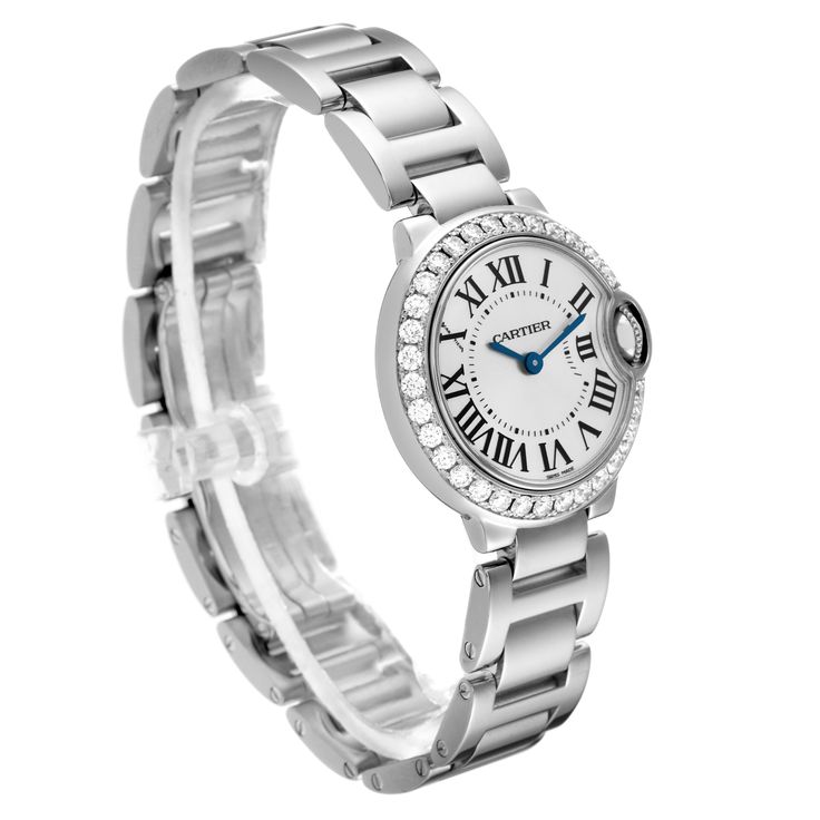 Cartier Ballon Bleu White Gold Diamond Bezel Ladies Watch WE9003Z3. Quartz movement. Caliber 057. Round 18K white gold case 28.0 mm in diameter. Case thickness: 9.35 mm. Fluted crown set with a blue sapphire cabochon. 18K white gold bezel set with original Cartier factory diamonds. Scratch resistant sapphire crystal. Silver sunburst dial with Roman numerals. Blued steel sword shape hands. 18k white gold bracelet with hidden butterfly clasp. Fits 6.5" wrist. Cartier Diamond Watch With Round Dial, Cartier Diamond Watch With Diamond Accents, Luxury Stainless Steel Diamond Watch With Metal Dial, Luxury Diamond Round Watch Bands, Luxury Stainless Steel Diamond Watch For Anniversary, Luxury Diamond Watch Bands With Round Shape, Diamond Watch Accessories With Subdials, Cartier Diamond Watch With Polished Finish, Cartier Polished Finish Watches For Wedding