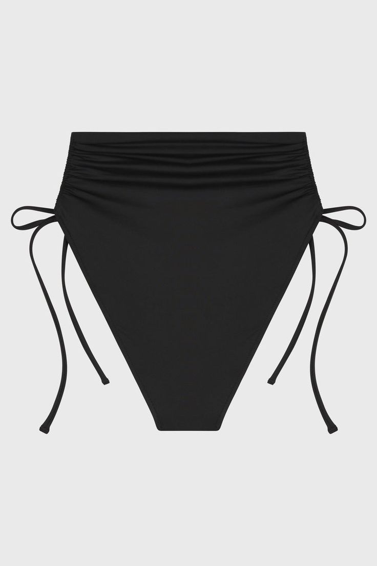 Brynn in black is a flattering, ruched bikini bottom that is self-lined in our ultra-soft, Italian Embodee™ fabric. Supremely comfortable, Brynn features rouleau ties in a side-casing so you can adjust the legline lower, or higher, as desired. For regular, black high waisted bikini bottom try Poppy - for a full bottom try Pippa. Luxury fabric sustainably made in Italy.Garment sustainably made in Australia. Black Drawstring Swimwear For Poolside, Ruched Tie-side Swimwear For Sunbathing, Black Swimwear With Drawstring For Pool, Black Drawstring Swimwear For Pool, Ruched Bottoms For Poolside, Beach Bottoms With Ruched Sides, Black Swim Skirt For Pool, Black Tankini With Drawstring For Swimming, Ruched Nylon Swimwear With Tie-side Bottom