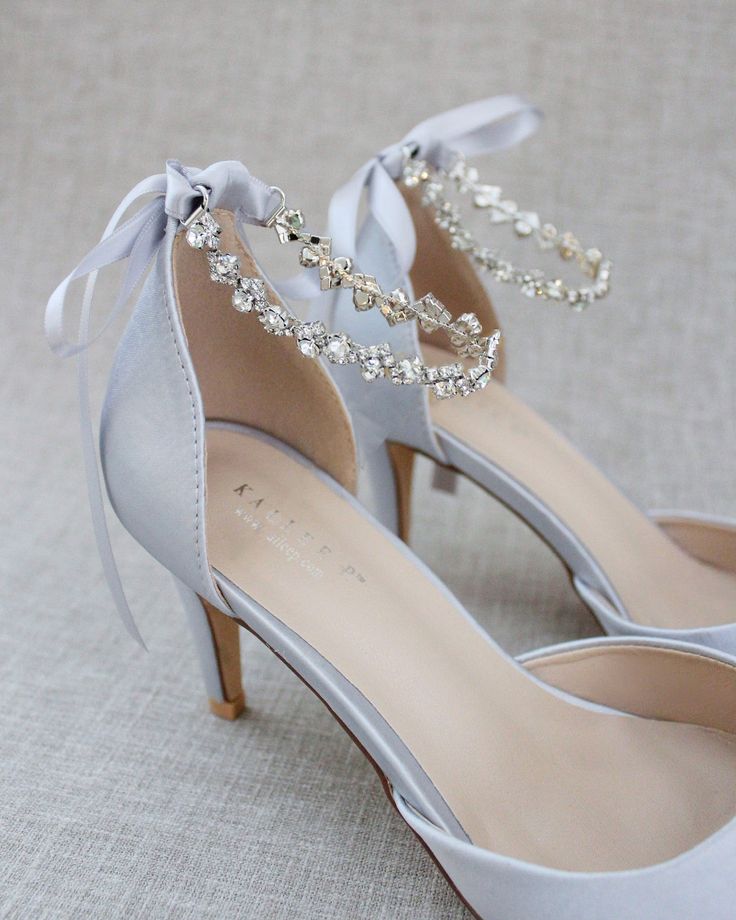 Wedding Shoes With Rhinestones And Ankle Strap, Silver Fitted Wedding Shoes With Ankle Strap, Elegant Embellished Wedding Shoes For Bridesmaid, Embellished Ankle Strap Wedding Shoes, Elegant Embellished Bridesmaid Wedding Shoes, Silver Heels For Bridesmaids, Fitted Silver Wedding Shoes With Ankle Strap, Silver Fitted Ankle Strap Wedding Shoes, Satin Heels With Rhinestones For Wedding