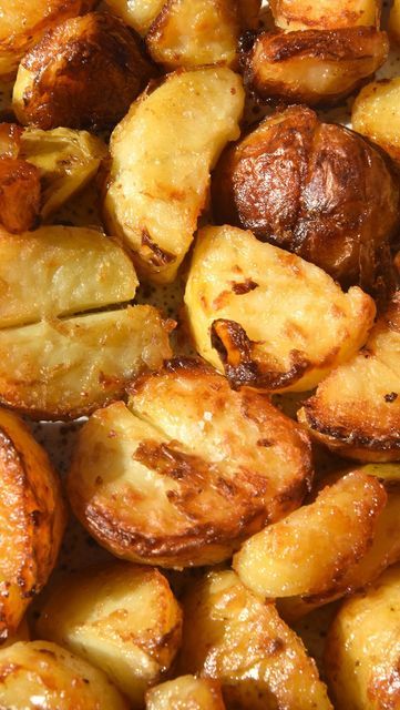 closeup of roasted potatoes with brown sauce