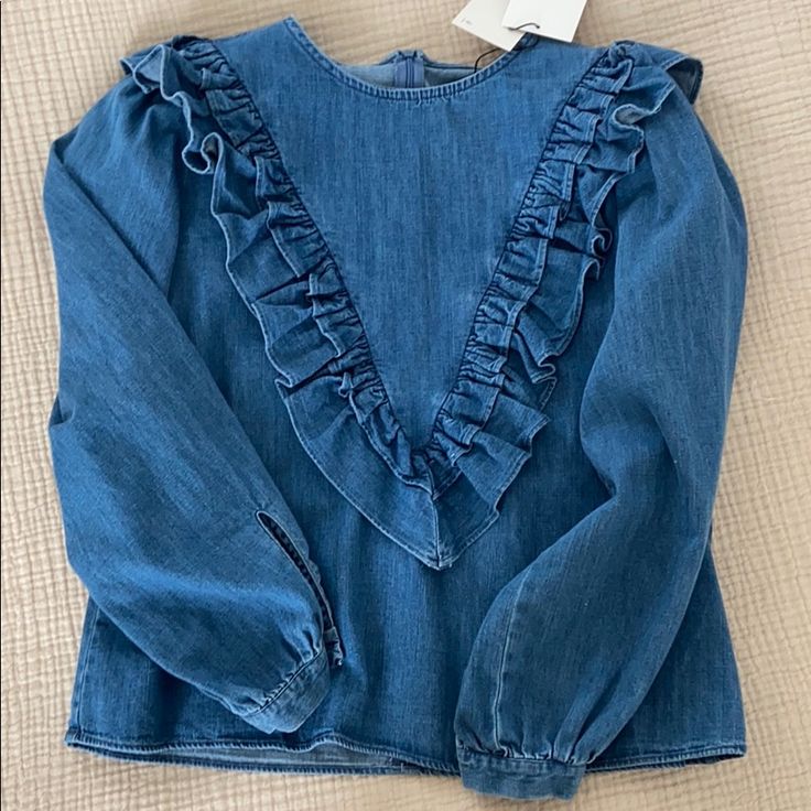 Adorable Denim Top From Zara. Never Worn! New With Tags. Trendy Light Wash Denim Blouse, Spring Indigo Denim Jeans, Trendy Washed Blue Denim Blouse, Light Indigo Denim Top For Fall, Fall Denim Top With Ruffles, Spring Ruffled Denim Jeans, Fall Light Indigo Denim Tops, Trendy Denim Blouse In Blue, Denim Blue Top For Spring