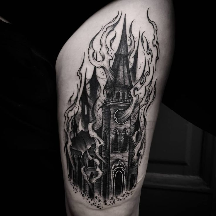 a black and white tattoo with a castle on it