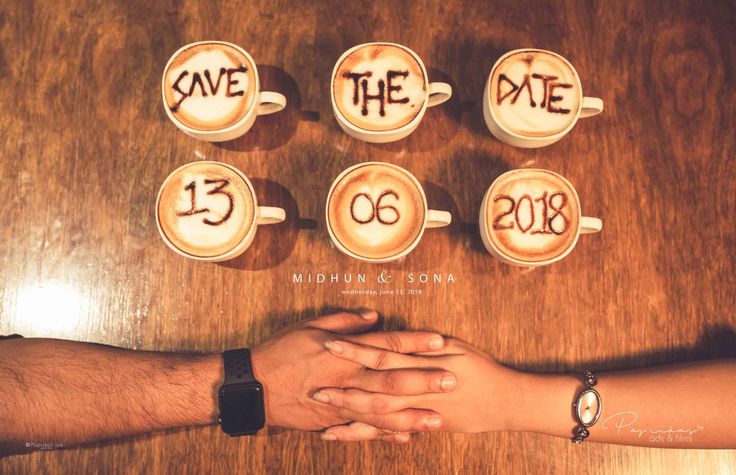 two people holding hands over coffee cups with the words save the date written on them