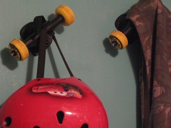 a red helmet hanging from the side of a wall