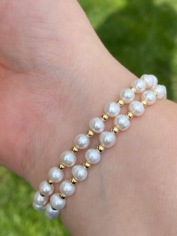 "△ DETAILS * 100% Genuine natural freshwater pearls, real pearls * Natural near round shaped pearls, size is approx. 5-5.5mm, natural white color with good luster * Handcrafted braided bracelet, double strand, 14K gold plated beads and push-in clasp, easy to use * 18th century pearl bracelet style , one of the most popular design for centuries, classic, historic, but also fashionable * For bracelet length, please ADD AT LEAST 1/2 INCHES to the WRIST size for a comfortable fit * Adorable, elegant Adjustable Pearl Bracelet With Pearl Drop And Round Beads, Adjustable Pearl Drop Bracelet, Akoya Pearl Charm Bracelet With Round Beads, Akoya Pearl Bracelet With Round Beads And Pearl Charm, Beaded Pearl White Round Bracelet, Pearl White Beaded Round Pearl Bracelet, Akoya Pearl Bracelet With Round Pearl Drop Beads, Akoya Pearl Bracelet With Pearl Charm, Akoya Pearl Bracelet With Pearl Drop