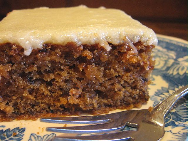 a close up of a piece of cake on a plate with a fork in it