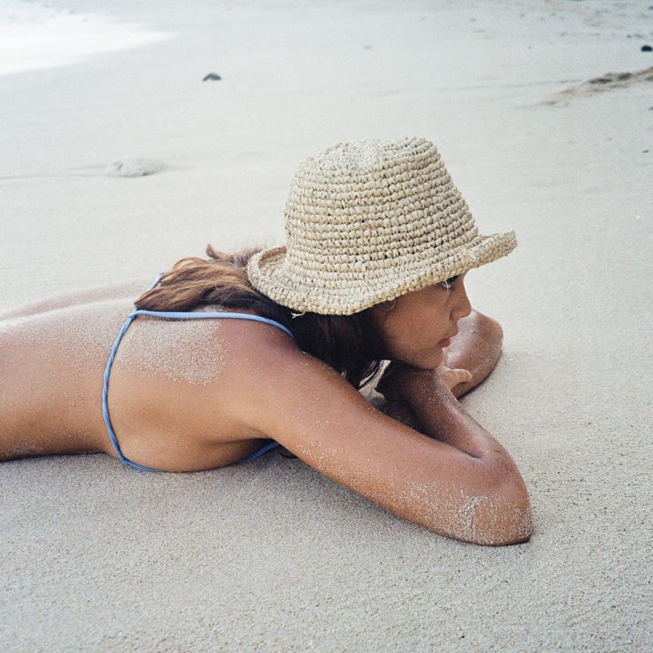 A comfy floppy hat, just as buckets should be. Ideal for frolicking in the sunshine, with sand underfoot and salt in the air. It’s a bit heavier than our other wide-brim straw hats so it won’t blow off your head on a windy day or while surfing. This sustainable hat is made from 100% natural straw, so it’s environmental footprint is as small as possible. One size but due to the handmade nature of the hat, size may vary. Hat stretches to fit most heads. Short Brim Straw Boater Hat For Sunbathing, Straw Boater Hat With Short Brim For Sunbathing, Brimmed Panama Hat For Sunbathing In Beach Season, Curved Brim Straw Hat For Beach Season Sunbathing, Brimmed Panama Hat For Beach Season, Summer Straw Hat For Sunbathing On Vacation, Beachwear Straw Hat For Sunbathing During Beach Season, Coastal Style Sun Hat For Beach Season Sunbathing, Brimmed Straw Hat For Sunbathing On Vacation