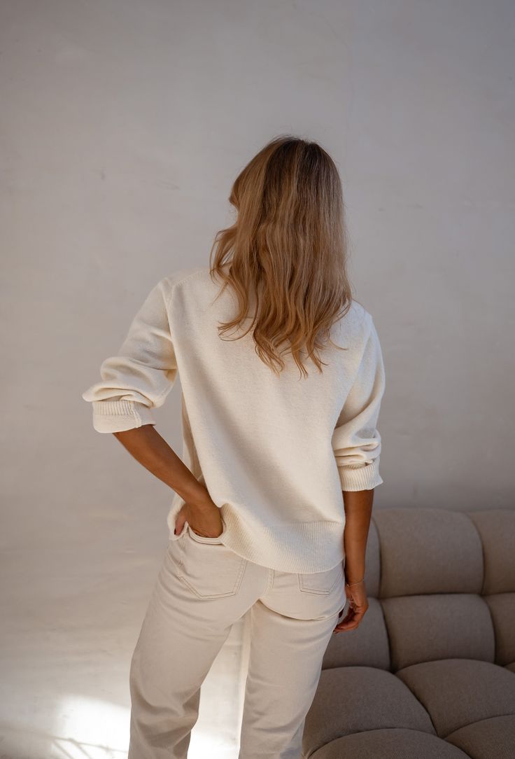 Stay cozy and chic in our ecru sweater, boasting long sleeves and front buttons for added style and versatility. Perfect for effortless elegance in any season. Our model wears the Beige Solan Jeans One size (fits from US 2-4-6-8-10) Length 22.83 in - Width 21.25 in. Handwash Only. Classic Cream V-neck Sweater For Fall, Cream V-neck Sweater For Workwear In Fall, Cream Relaxed Fit Sweater For Fall, Casual Beige Knit Sweatshirt, Cream Crew Neck Cardigan, White Soft Knit V-neck Sweater For Layering, Cozy White Textured Knit V-neck Sweater, Cotton V-neck Long Sleeve Sweater For Work, White Long Sleeve V-neck Sweater With Ribbed Cuffs