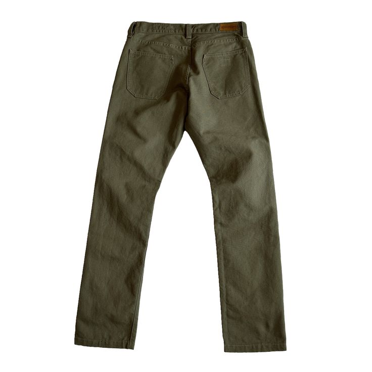 STORY Our flagship pant, the Foundation has been with us since the very beginning. This timeless classic was designed and built to be as ready an option as your favorite pair of jeans; they will no doubt contend for the top position as your go-to pant for daily wear in all conditions. Attention to details and fit, the Foundation is built with function, durability and versatility all in mind. This pant is constructed in our State-side Canvas, a substantial fabric that has a special finish that will develop unique patterns and slowly fade to add character and make each garment one of a kind. Imagine the fades of your favorite worn in Jean but in canvas earth tones, blue or black. Whether you like to keep the pant clean or like the fading, we created the canvas, make it your own. PROCESS Rend Classic Fitted Jeans, Solid Color Tapered Leg Jeans With Five Pockets, Selvedge Cotton Tapered Leg Pants, Five Pocket Tapered Leg Jeans, Chino Twill Jeans With Hip Pockets For Work, Cotton Selvedge Tapered Leg Pants, Cotton Selvedge Pants With Tapered Leg, Solid Color Tapered Straight Leg Pants, Selvedge Cotton Bottoms For Work