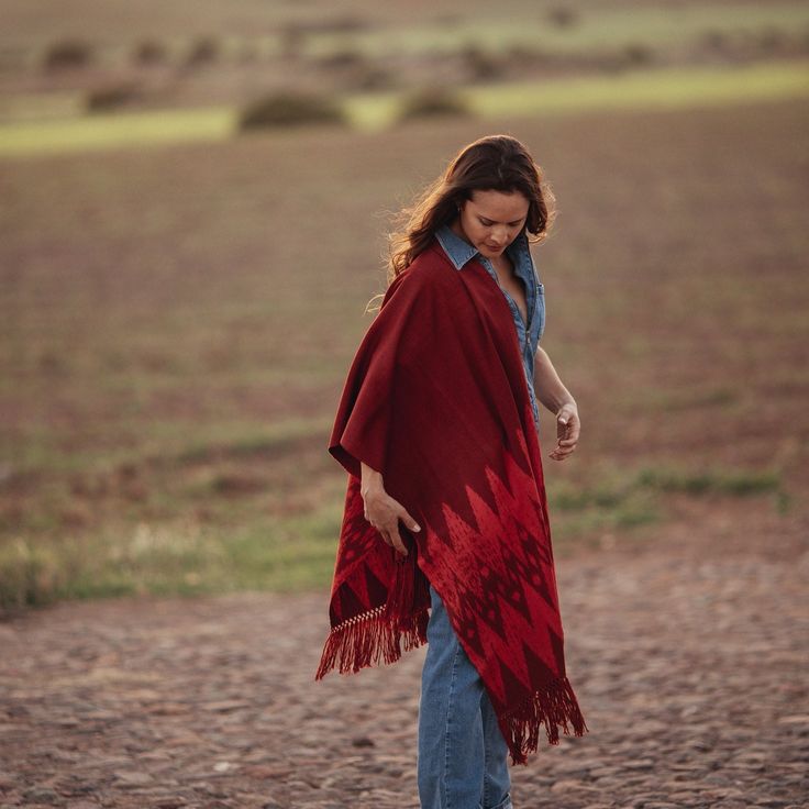 "Luxury shawl made in macana, an artisan fabric handmade in Ecuador (Ikat technique). 100% cotton - 70% organic pigments. The \"Macana\" is an artisan fabric handmade on waist looms with organic cotton. The ancestral technique called \"Ikat\" has been transmitted for generations in the Andes of southern Ecuador. The tints used to dye the fabrics are of natural origin (plants, fruits and vegetables). Yakina wants to revalue and perpetuate this centuries-old tradition, thanks to fair trade with the network of artisans from the Gualaceo region (Ecuador)." Bohemian Shawl Scarf With Natural Dye, Bohemian Shawl Scarves With Natural Dye, Traditional Red Shawl Poncho, Bohemian Red Pashmina Scarf, Red Bohemian Pashmina Shawl, Red Bohemian Pashmina Scarves, Red Pashmina Bohemian Scarf, Red Bohemian Ikat Print Dupatta, Red Bohemian Shawl With Woven Motifs