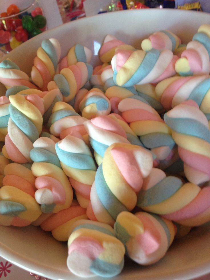 a bowl filled with lots of colorful candy