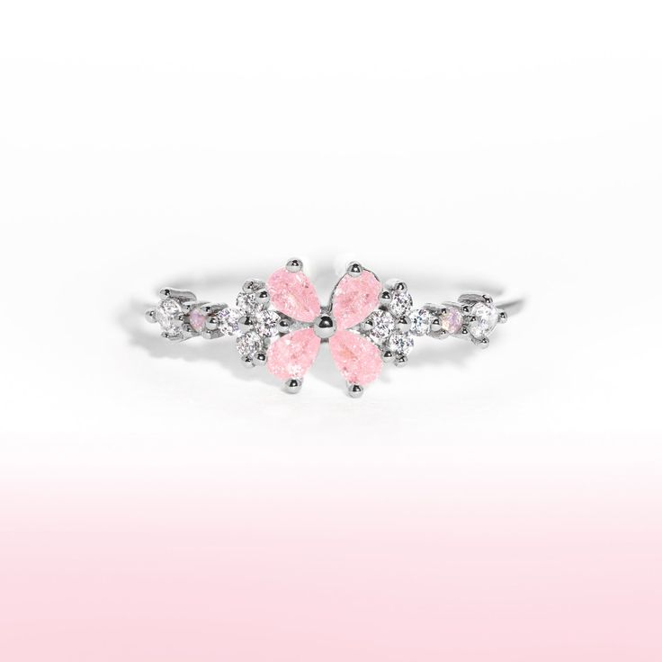 This ring is for everyone, but especially for all of our girly twirly pops! Our Bravissimo Ring adds the perfect amount of pink and sparkle to your stack! Silver Butterfly Ring For Parties, Pink Open Ring For Party, Rose Gold Flower Rings For Party, Pink Round Stackable Jewelry, Pink Stackable Round Jewelry, Elegant Pink Flower Rings, Elegant Pink Flower Shaped Rings, Elegant Pink Flower Open Ring, Elegant Pink Flower-shaped Rings