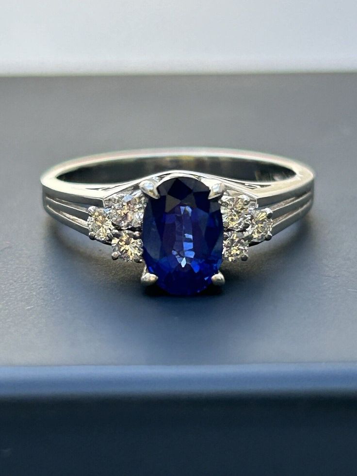 This stunning ring features a beautiful combination of blue sapphire and diamond set in platinum. With a ring size of 5.5, this piece is perfect for those who appreciate fine jewelry. The ring is crafted from high-quality platinum and features six diamonds, making it a unique and special addition to any collection. The blue sapphire is the star of the show, with its vibrant color catching the eye of anyone who sees it. This ring is a must-have for anyone who loves fine jewelry and wants to add a touch of elegance to their wardrobe. Classic Gia Certified Sapphire Ring, Classic Blue Sapphire Ring In 14k White Gold, Timeless Sapphire Cluster Ring With Prong Setting, Brilliant Cut Sapphire Diamond Ring In Platinum, Classic Blue Brilliant Cut Diamond Ring, Classic Blue Diamond Ring With Brilliant Cut, Classic Blue Sapphire Ring With Round Cut, Gia Certified Blue Sapphire Ring In Platinum, Timeless Round Cut Sapphire Ring