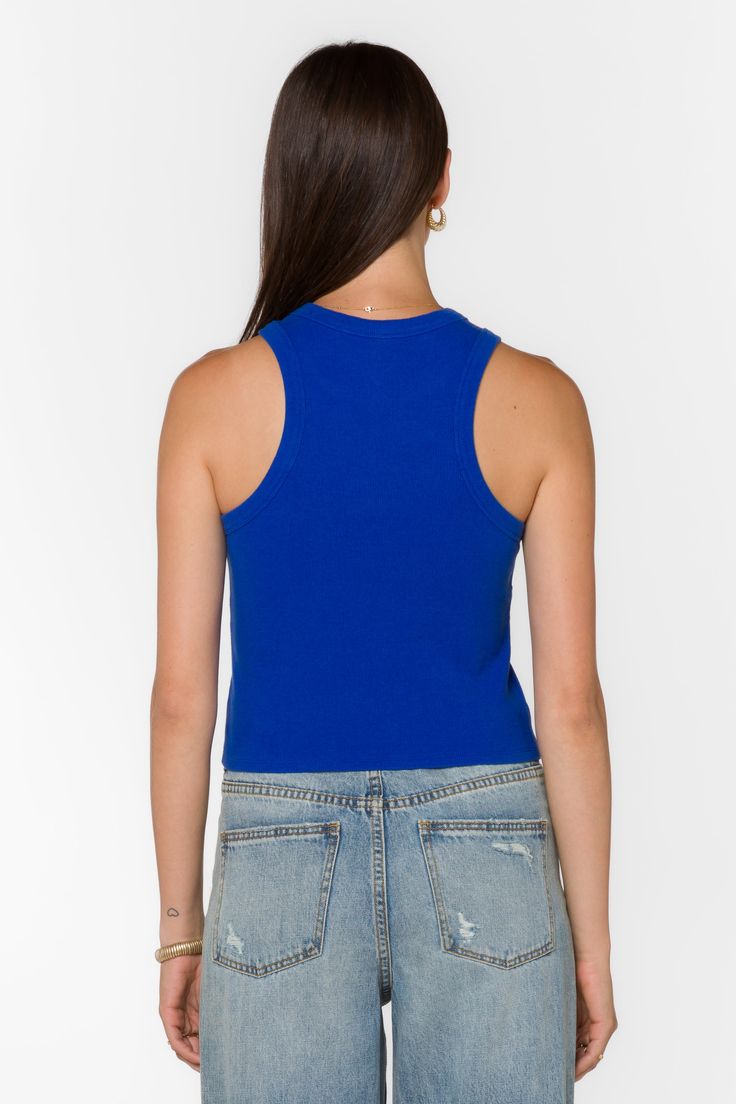 The Weston Top features a ribbed knit and racerback tank design. Perfect for warm weather, this top provides both comfort and style. Material: 95% Cotton and 5% Elastane Machine Wash Cold Color: Dazzling Blue Model is 5'9" and wearing a size S Imported Spring Crew Neck Tank Top In Athleisure Style, Spring Athleisure Crew Neck Tank Top, Spring Athleisure Tank Top With Crew Neck, Cotton Ribbed Racerback Crop Top, Ribbed Cotton Racerback Crop Top, Casual Ribbed Stretch Tank Top, Casual Stretch Ribbed Tank Top, Sporty Ribbed Crew Neck Tank Top, Casual Stretch Tank Top With Ribbed Neckline