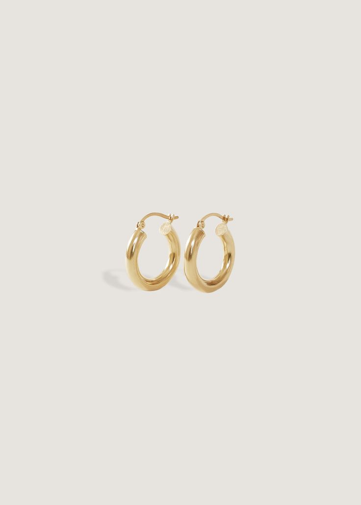 Your favorite oversized hoops. Wear them day to night, with jeans and a white tee or a power pant suit. We made them easy to put on (trust us, we've tried on every hoop!) and hollow, so they won't weigh you down.Complete the look with our Pavé Hoop Huggie Earrings. Hinged back closure. 14k solid gold—always Weight: 0.5g per earring Measurements: 3x15mm Minimalist 14k Gold Hoop Earrings With Shiny Finish, Classic Tarnish Resistant 14k Gold Huggie Earrings, Classic 14k Gold Tarnish Resistant Huggie Earrings, Timeless 14k Gold Tarnish Resistant Hoop Earrings, Classic Round Hoop Earrings For Everyday, Classic Small Hoop Jewelry For Everyday, Classic 14k Gold Filled Hoop Earrings For Everyday Luxury, Timeless Small Hoop 14k Gold Huggie Earrings, Classic 14k Gold Hoop Earrings With Shiny Finish