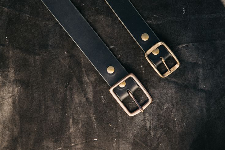 Simple, durable and works with everything. Hand made in our California shop of high quality 8oz American latigo leather, with a solid brass buckle. True to size, will soften and patina with wear. 1.75" thick leather strap. Classic Black Belt With Brass Hardware, Everyday Leather Belts With Brass Hardware, Classic Black Belt With Brass Buckle, Classic Black Belts And Suspenders With Brass Buckle, Vintage Bridle Leather Belt For Everyday Use, Adjustable Brass Belt Buckle For Everyday Use, Adjustable Brass Buckle Belt For Everyday Use, Classic Belts With Brass Buckle For Everyday Use, Classic Everyday Belts With Brass Buckle