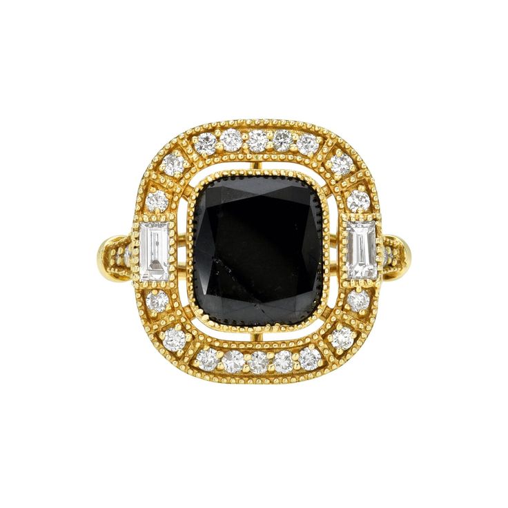 Introducing the Midnight Embrace Ring, a breathtaking masterpiece that embodies luxury and allure. At its heart lies a stunningly large black diamond, exuding an intense, enigmatic brilliance that captures the essence of a starless night sky. The diamond is elegantly encircled by a halo of shimmering white diamonds and two baguette diamonds on both sides, amplifying its dramatic sparkle and creating a striking contrast against the dark, mysterious center stone. Set in lustrous 18k white gold, th