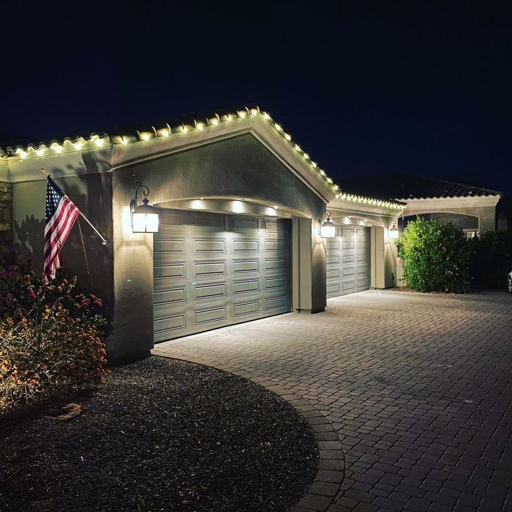 a house with lights on the roof and driveway