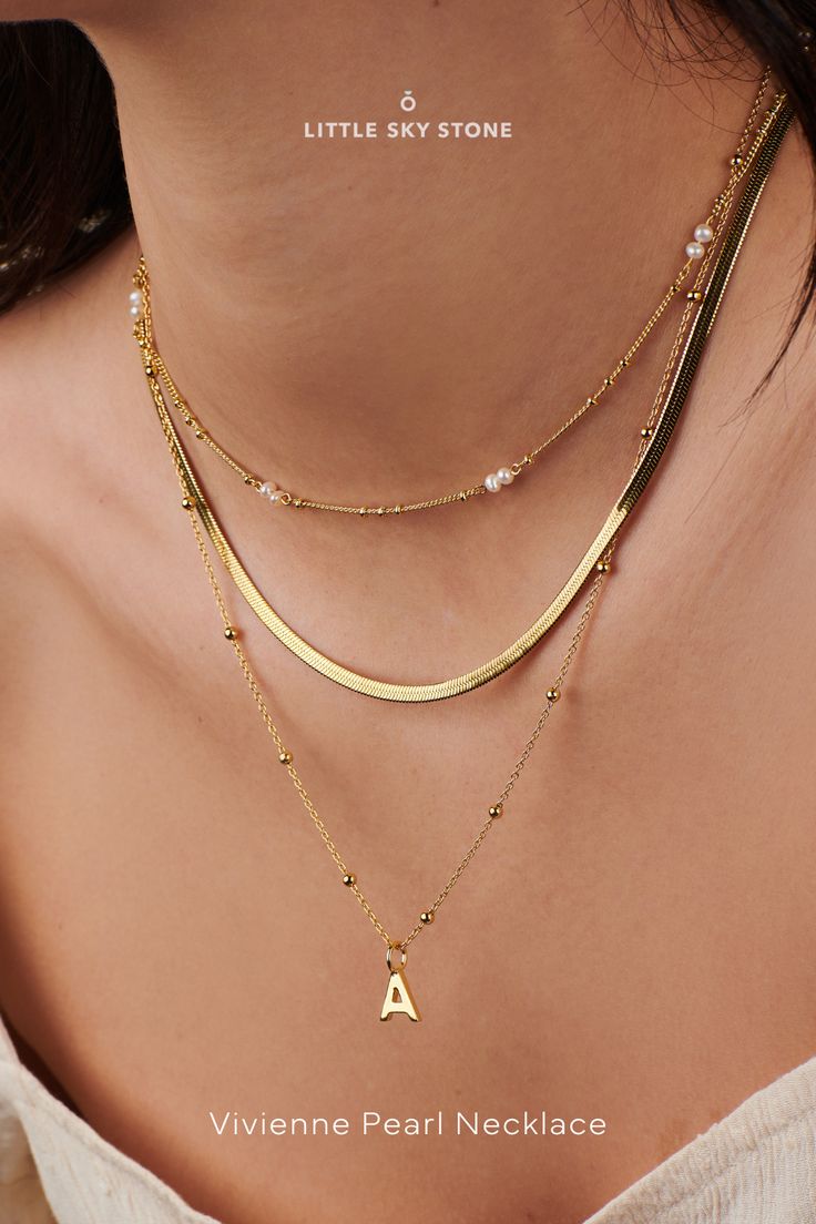 Elevate your style with our Vivienne Pearl Necklace, a stunning embodiment of sophistication and grace. Handcrafted with freshwater pearls and adorned with a thick layer of 14k gold, this personalized jewelry piece exudes timeless charm. Perfect for layering or solo wear, it's a must-have accessory. Shop now for the ultimate pearl initial necklace experience!" 🌟✨ #pearlnecklace #personalizedjewelry #14kgold #timelessbeauty Bead Pearl Necklace, Pearl Gold Necklace, 14k Gold Plated Jewelry, Gold Pearl Necklace, 14k Gold Necklace, Necklace Pearl, Engraved Jewelry, Gold Filled Jewelry, Gold Plated Jewelry