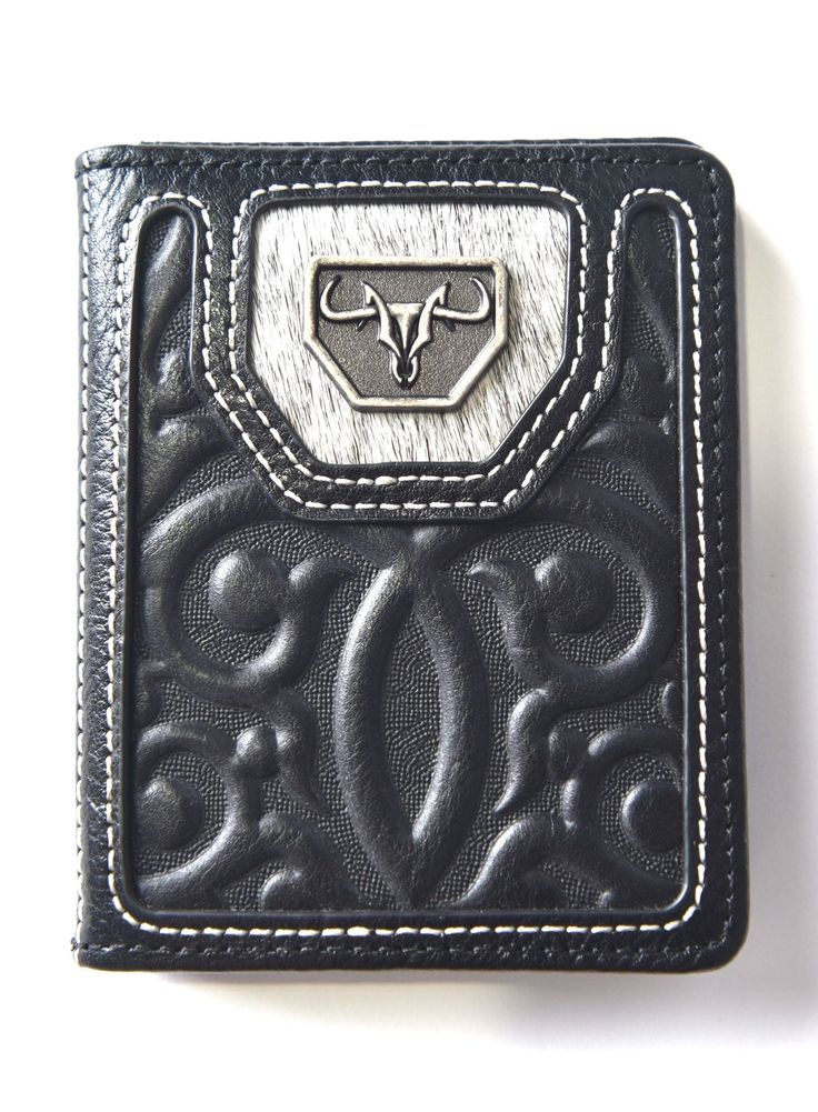 Elevate your western-inspired accessories with our Men's Genuine Leather Wallets featuring Faux Calf Hair by Platini Jeans. These wallets boast a unique exterior texture, combining the authenticity of genuine leather with the distinctive charm of faux calf hair. Crafted for those who appreciate the western aesthetic, these wallets blend style with functionality. Key Features: Genuine Leather: The wallet's outer surface is made from high-quality genuine leather, ensuring durability and a genuine Black Hand Tooled Bifold Wallet, Exterior Texture, Western Aesthetic, Mens Wallet, Genuine Leather Wallets, Leather Wallets, Kids Outerwear, Blazers For Men, Calf Hair