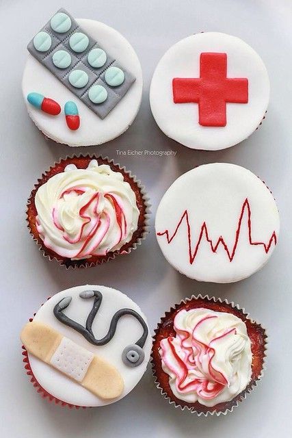 cupcakes decorated with icing and medical symbols