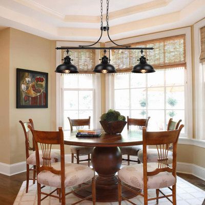 a dining room table with four chairs around it