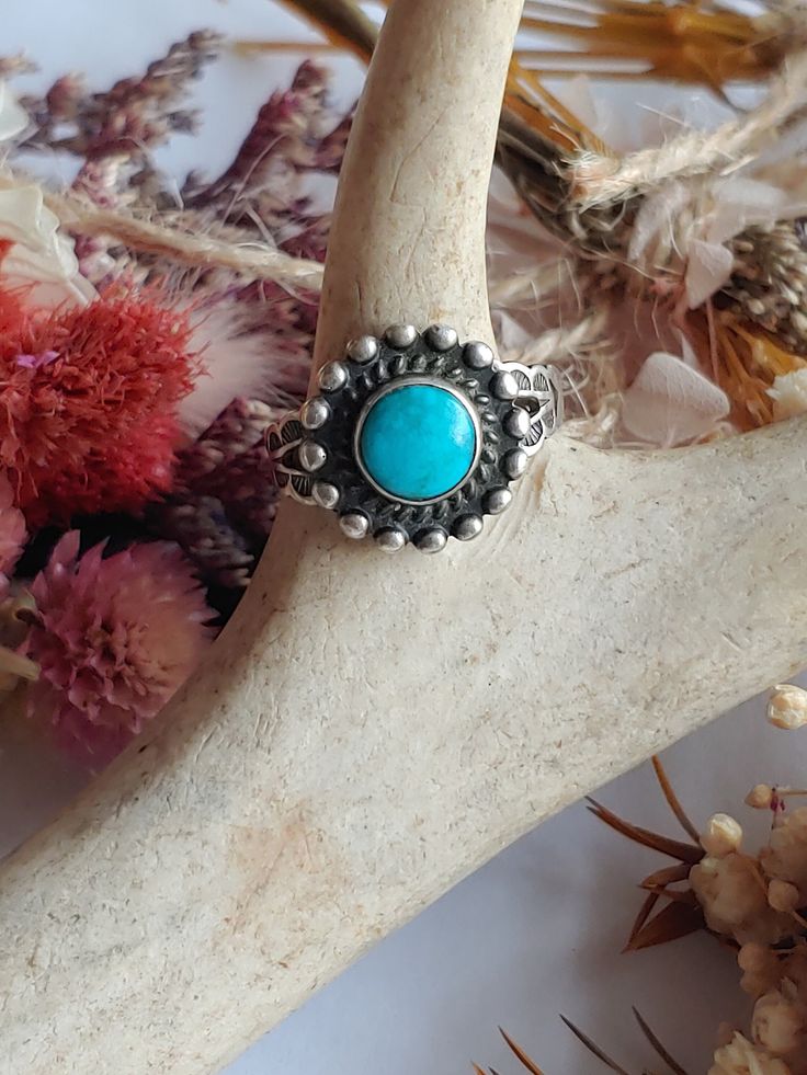 Vintage Navajo Sterling Silver turquoise Ring.  **The band has been cut on this, making it adjustable. I would say between 5.50-6.25" US.** **This could be easily soldered by a local shop if desired**  This is a used item with scuffs from age, please view pictures. Basic info: Size- Approx. 5.50-6.25"" US Color: Silver / blue Type- Silver work  Cut- Circle weight- approx. 3.3g Silver Mark-  STERLING Maker Mark - N/A SHIPPING: All orders are guaranteed to ship the same or following day. If your purchase occurs on a Sunday you may request UPS shipment as the post office is closed. Shipping in the United States usually takes 3-4 days Adjustable Southwestern Style Turquoise Ring Nickel Free, Bohemian Blue Turquoise Ring Stamped 925, Western Style Adjustable Round Rings, Adjustable Bohemian Ring For Festivals, Artisan Adjustable Rings For Festivals, Handmade Western Turquoise Ring, Adjustable Sterling Silver Turquoise Ring In Western Style, Handmade Western Turquoise Ring As A Gift, Bohemian Turquoise Ring Stamped 925