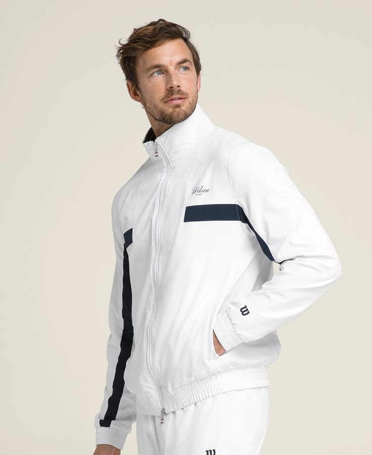 Grand Slam Jacket | Wilson Sporting Goods White Track Jacket With Ribbed Collar For Winter, Sporty White Outerwear With Ribbed Collar, Casual White Track Jacket With Stand Collar, White Athleisure Track Jacket With Pockets, Sporty Track Jacket With Elastic Cuffs For Spring, Spring Sporty Track Jacket With Elastic Cuffs, Casual White Outerwear With Elastic Cuffs, Athleisure Track Jacket With Ribbed Collar For Sports, Athleisure Track Jacket With Ribbed Collar