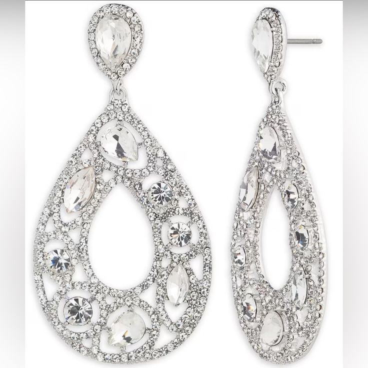 Orbital Drop Earrings Silver Tone Rhodium /Crystal Zinc 60%, Glass 40% Pierced Post-Closure Approx. 2.7'' X 1.34'' Sparkling Crystal Chandelier Earrings For Anniversary, Silver Pear-shaped Chandelier Earrings For Evening, Bling Crystal Earrings For Anniversary, Glamorous Crystal Drop Bridal Earrings, Glamorous Teardrop Chandelier Earrings With Diamond Accents, Anniversary Crystal Chandelier Earrings With Rhinestones, Clear Crystal Earrings For Party, Party Crystal Clear Earrings, Anniversary Chandelier Earrings With Rhinestones