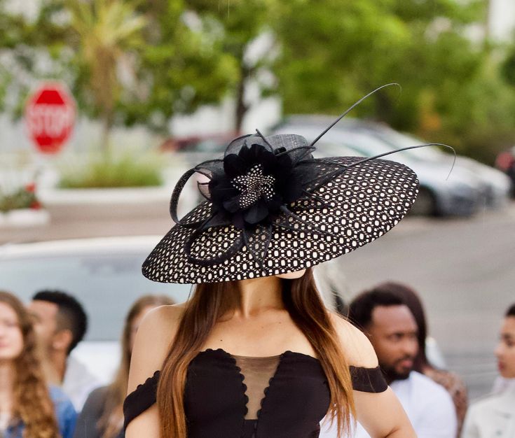 Beautiful black/cream 500mm brim hat couture classical hat for elegant ladies. Wear it at the weddings, or church or Ascot or Derby or club events- you will be definitely make a statement! Featured in Avant Garde magazine 2017. This hat is made of sinamay and covered with very unique mesh material. adorned with large feather flower and quills. Sinamay loops add an extra touch. It can be made in a wide range of colors and sizes. but the cover material will remain black.Please email me about the o Elegant Black Cloche Mini Hat, Elegant Black Mini Hat For Church, Elegant Black Cloche Fascinator, Elegant Mini Hat With High Crown For Spring, Elegant High Crown Mini Hat For Spring, Elegant Black High Crown Mini Hat, Black Hat For Spring Events, Luxury Black Hat For Spring, Elegant Spring Top Hat With High Crown