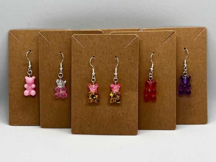 Gummy Bear Earrings! They are made with hypoallergenic silver plated zinc alloy hooks and rings. Each pair comes with rubber backings.  I started this shop to help pay for school. Gummy Bear Earrings, Bear Earrings, Gummy Bear, Pink Ombre, Gummy Bears, Wedding Shop, Green And Gold, Zinc Alloy, Jewelry Earrings Dangle