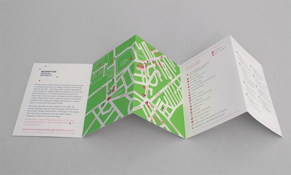 an open brochure with a map on the front and back pages in green