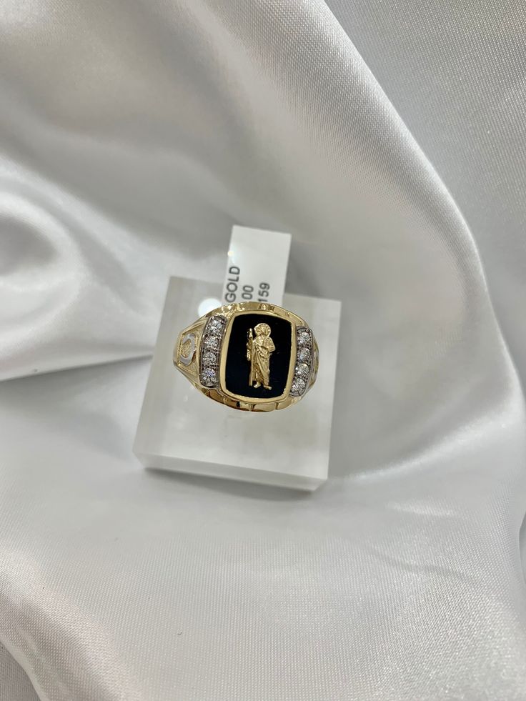 -14K San  Judas Ring  -100% Gold -Size 10.5  - Yellow gold  -Cubic zirconia  -Item sold by piece. Weight undetermined. Gold Engraved Ring With Cubic Zirconia For Formal Occasions, Luxury Gold Engraved Ring With Cubic Zirconia, Collectible Gold Rings With Diamond Accents, Luxury Diamond Signet Ring Collectible, Collectible Yellow Gold Rings With Diamond Accents, Hallmarked Gold Signet Ring With Cubic Zirconia, Gold Hallmarked Cubic Zirconia Signet Ring, Gold Cubic Zirconia Hallmarked Signet Ring, Fine Jewelry Cubic Zirconia Signet Ring Stamped 14k