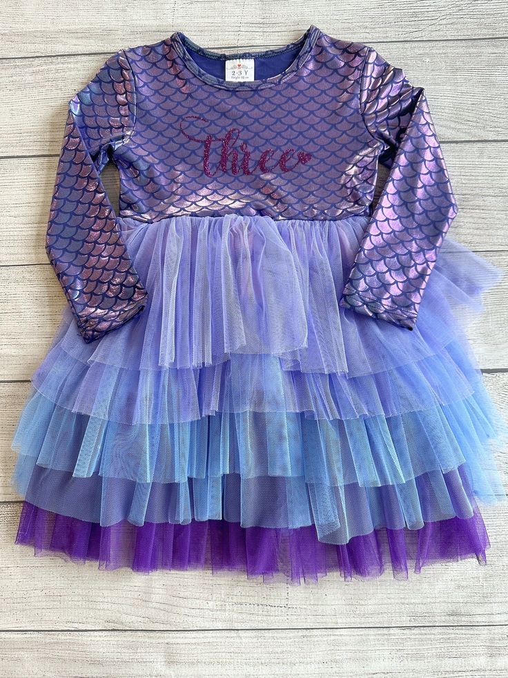 "♥ Product Information: Bodice/Lining: 70% cotton+30% spandex. Mermaid Birthday dress is the perfect mix of play and style with plenty of twirl factor.   Long sleeve tutu dress features a mermaid spandex on the top half of the dress.  There is lining under the tulle so it doesn't itch the legs.  I do not make this dress, I only add the wording on the dress.  Heat transfer for the age 'FIVE' is dark purple in pictures.  ♥Size Measurements   2/3T - Age: 3 - Height: 36-39 inches - Chest: 21 inches Fitted Long Sleeve Dresses For Dress-up Occasions, Long Sleeve Tutu Dress For Party, Fitted Tutu Dress With Ruffles For Costume Party, Fitted Long-sleeved Princess Dress For Birthday, Fitted Long Sleeve Princess Dress For Birthday, Fitted Long Sleeve Princess Dress For Birthdays, Pink Stretch Dresses With Mermaid Hem, Stretch Pink Dresses With Mermaid Hem, Cute Fitted Dress For Costume Party