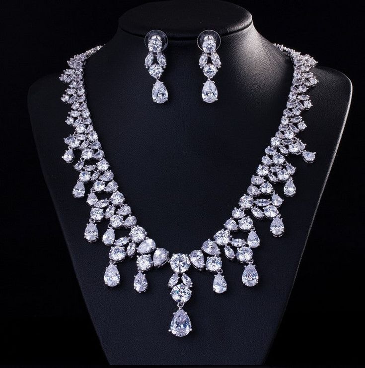 Jazz up your eveningwear with our Dazzling Drops Jewelry Set. This elegant jewelry set features a stunning necklace and dangling earrings design created with shimmering cubic zirconia stones, which'll make you shine like the star you are. Premium Materials - Made from authentic gemstones & nickel-free metals Bridal Party Jewelry Sets, Bridal Party Jewelry, Costume Jewelry Sets, Cubic Zirconia Jewelry, Necklace Chain Lengths, Girl Friend, Cz Jewelry, Mom Daughter, Wedding Jewelry Sets