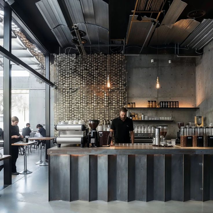 the interior of a restaurant with people sitting at tables