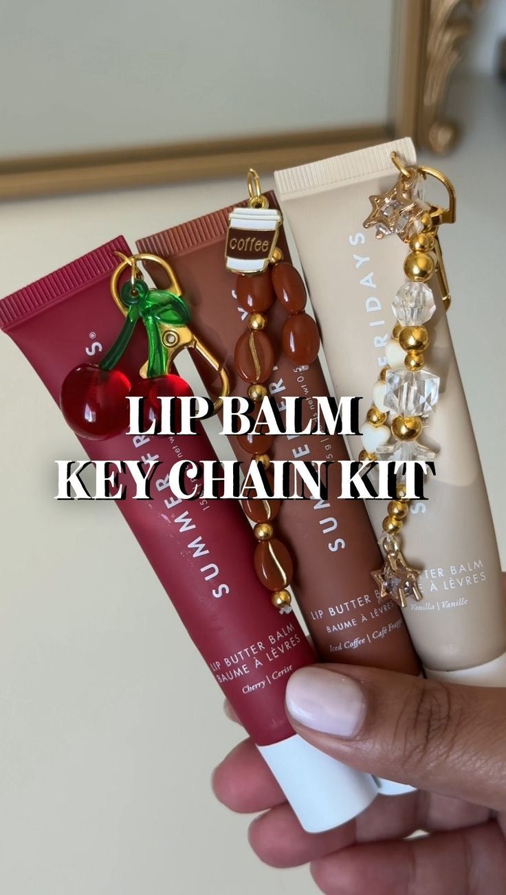 Lip Balm Key Chain Kit! You will receive: -key clasp and ring -2 ring links - 2ft of elastic thread -20-25 smaller beads  -Main Charm depending on which set you choose! (Cherry, strawberry cake, diamond stars, coffee cup) *LIP BALM NOT INCLUDED* *hole puncher also not included! Please use a thumbtack or safety pin to make the hole in the lip balm* Lipgloss Bottle Design, Lip Balm Rings, Lip Balm Organization, Charms On Lip Gloss, How To Get Smaller Lips, Summer Fridays Lip Balm Keychain, Lip Gloss With Charms, Lip Gloss Charm Diy, Lip Balm Charm Keychain