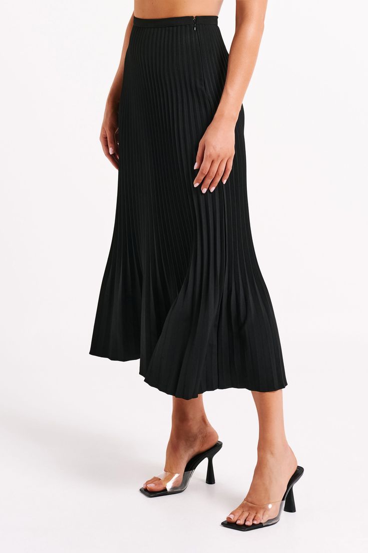 Pleats please.This is a full-length maxi skirt with an invisible side zipper and waist-to-hem pleats. Fresh and versatile, its polyester-and-elastane fabrication allows it to look loose and flowy without losing its structure. Small details like the fitted waist and pleated hem for visual appeal but at a timeless length. We recommend sizing down in this style. Chic Flowy Skirt With Wide Hem, Pleated Flared Maxi Skirt For Evening, Evening Pleated Flared Maxi Skirt, Flowy Party Maxi Skirt With Pleated Hem, Evening Midi Skirt With Pleated Hem, Fitted Pleated Midi Maxi Skirt, Fitted Flared Maxi Skirt With Pleated Hem, Long Pleated Skirt For Evening, Pleated Midi Maxi Skirt For Party