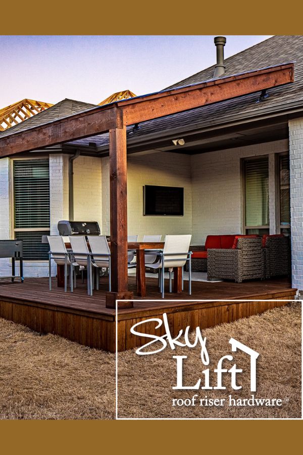 an outdoor living area with wooden decking and patio furniture