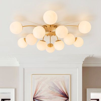 a living room filled with furniture and a large painting on the wall above it's head