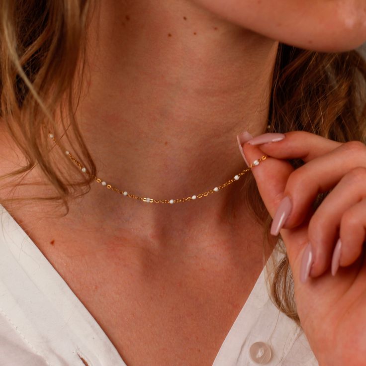 WHITE BEADED NECKLACE CHAIN ∙DETAILS Length: 18'' / 45cm Width: 2mm ∙MATERIALS High-quality stainless steel, plated with 18k gold. ∙ ∙SHIPPING IMPORTANT: before placing an order, please double check that your address is correct to avoid any delays. Shop more one-of-a-kind pieces: https://www.etsy.com/shop/SeraphinJewelry Thank you so much for visiting and hope you enjoy shopping with us ♡ -Seraphine ♡ All images are copyrighted by IDOLAJEWELRY. All rights reserved. White Pearl Chain Necklace With Round Beads, Dainty Pearl Chain Charm Necklace Choker, Dainty Pearl Chain Choker Necklace, Dainty Pearl Chain Charm Necklace, Pearl White Necklace With Chain For Gifts, White Pearl Necklace With Round Beads, Adjustable White Chain Necklace Gift, White Beaded Necklaces With Round Beads And Chain, White Pearl Choker With Adjustable Chain